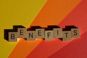 Benefits, Word in 3D wooden alphabet letters isolated on background